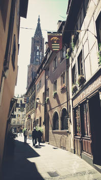 France, Alsace, Strasbourg, side street with view of Strasbourg Cathedral