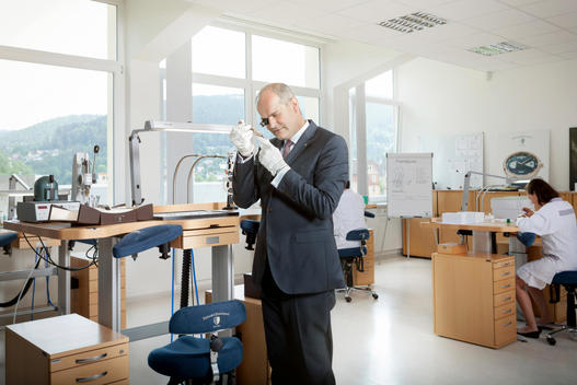 Matthias Stotz, CEO of German watch company Junghans, checks the quality personally at the Junghans watch assembly in the Black Forest.