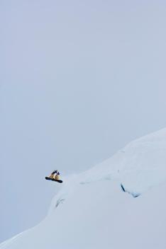 Shayne Pospisil spins off of a cliff in Valdez, Alaska.