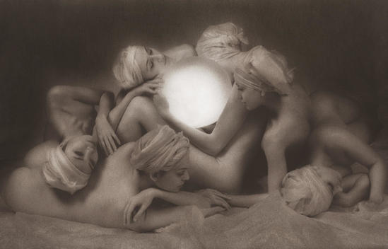 Six anonymous nude women surrounding a large luminous lit globe, some obscured with only heads revealed