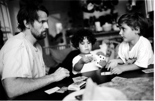 Two Boys With Father Playing Cards