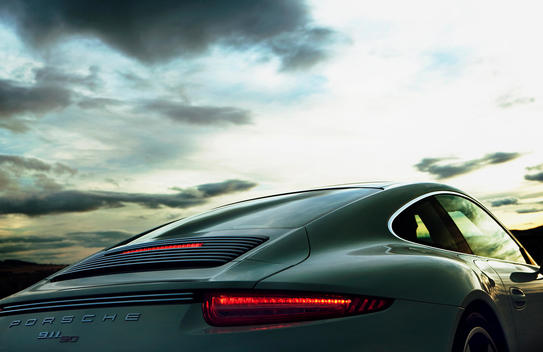 Porsche 911 50th anniversary car backside with sunset