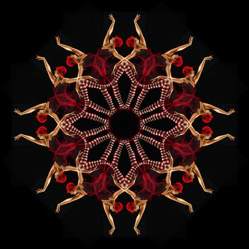 Mandala pattern created by multiple exposure of young woman's wearing red costume