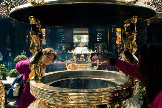Volunteers Cleaning The Golden Incense Burner In The Old Buddhist And Taoist Longshan Temple