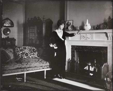 Elsie Ferguson In What Appears To Be Her Residence At 350 Park Avenue, Standing Beside A Fireplace.