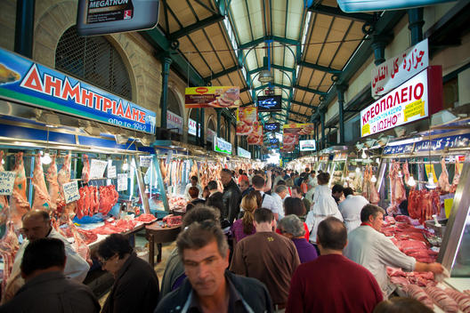 Crowd Walking Through A Meat Market, Athens, Greece.