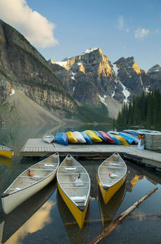 Colorful canoes on dock of Moraine Lake