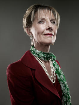 Portrait Of A Well Dressed Senior Woman Wearing A Pearl Necklace In Studio