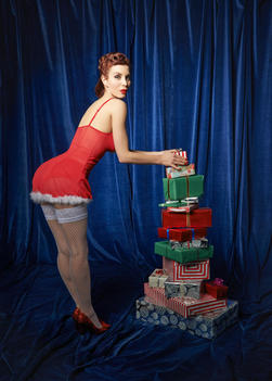Burlesque woman with Christmas gifts