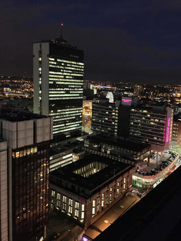 Manchester at night, looking towards the lights of the City Tower and Piccadilly Gardens.