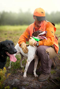 Hunting dogs and trainer
