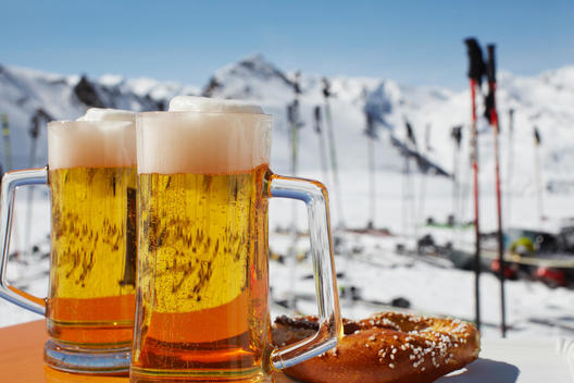 Two glasses of beer on outdoor cafe table, Austria