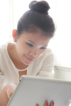 Woman Using Tablet PC