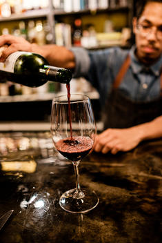 A bartender pours wine at Intimo restaurant in Panama City, Panama.
