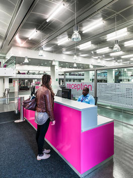 Student at reception in London Metropolitan University designed by Cartwright Pickard Architects, London, UK.
