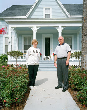 Senior Couple Outside Their Home