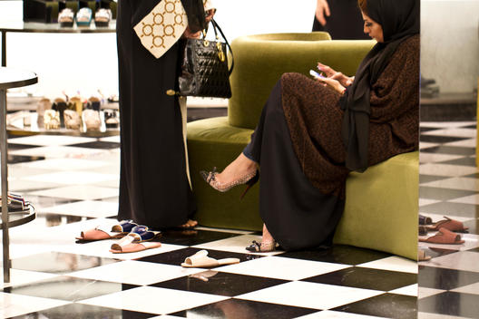Emirati women trying on shoes