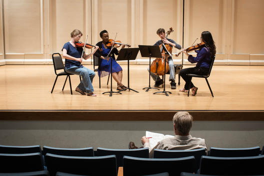 Students playing in college string quartet