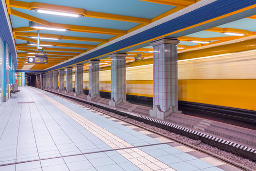 Germany, Berlin, subway station Lindauer Allee with moving underground train