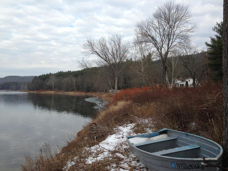 Rowboat on bank of Delaware River, Upstate New York, Winter