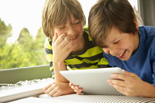Boys Using Digital Tablet Smiling