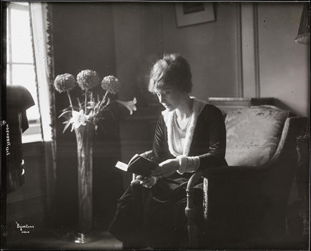 Elsie Ferguson In What Appears To Be Her Residence At 350 Park Avenue, Seated In A Chair By A Window, Reading A Book.