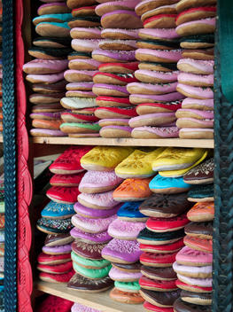 Slippers stacked and for sale in a shop in the medina at Fes, Morocco