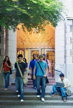Group of college students leaving building