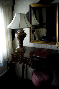 desk and lamp in front of mirror, Bedroom of The Mermaid Inn, Rye