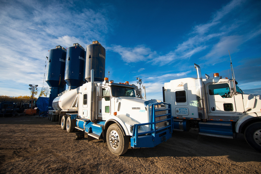 Trucks with liquefied natural gas hydraulic fracturing (fracking) fluid material ready to mix.