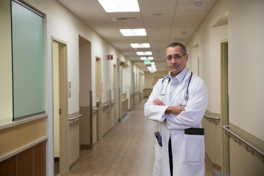 Mixed race doctor standing in hospital corridor