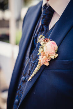 small bouquet, floral decoration at the suit of the groom