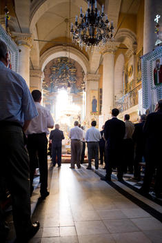 Church Interior With People Standing At Mass Service