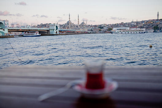 General View of Ancient Peninsula in Istanbul while the traditional Turkish tea glasses stands on a table.