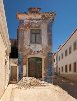 Crumbling building facade in Ericeira, Mafra, Portugal