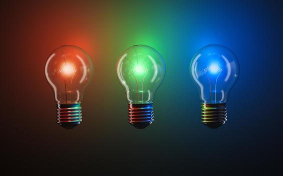 3 common house bulbs emit red green and blue against a dark background