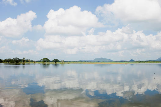 Clouds Reflecting Off The Surface Of Tissa Lake, Tissamarama, South Coast, Sri Lanka.