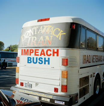 Bus With Anti-George Bush Slogan Painted On It At An Anti-War Rally.