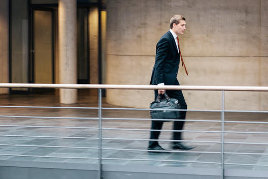 Portrait of young business consultant rushing to work