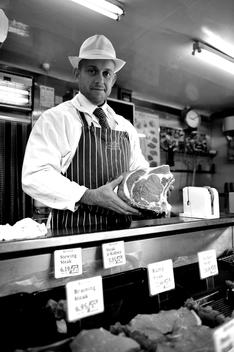 a butcher displays a side of beef in Swain Butchers in York