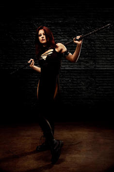 Portrait of female Foam weapons league character holding her staff.