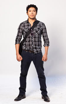 Asian-American-Looking Man 30-35 Years Old With Plaid Shirt And Corduroys, Messenger Bag, Full Body Studio Portrait On White Background