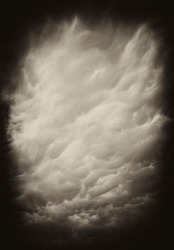 Dark storm cloud after a summer storm. Stylistic effects were used to enhance the darkness and the drama of the cloud.