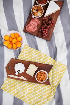 Picnic snacks on a wooden serving trays.