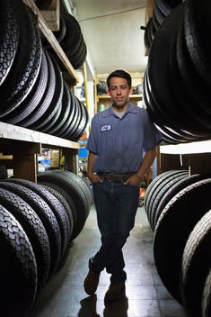 Mixed race worker in tire store