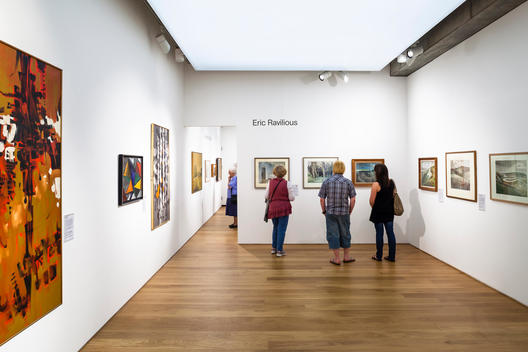 People viewing artwork at the Towner Gallery designed by Rick Mather Architects, Eastbourne, UK.
