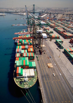 Cranes over container ship at commercial dock, Port of Los Angeles, California, United States