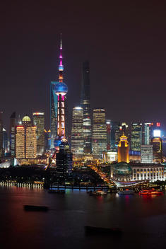 Oriental Pearl Tower at night, Shanghai Tower (under construction) and Shanghai World Financial Centre in Pudong, Shanghai, China