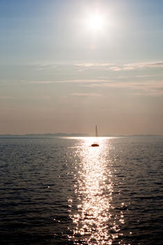 sailboat in sparkling sea