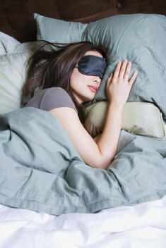 Woman sleeping with eye mask